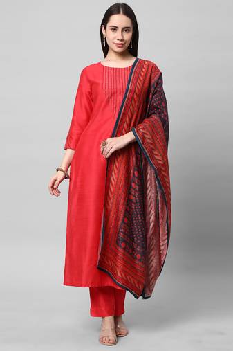 A straight kurta set with machine embroidery embellished with cut work.