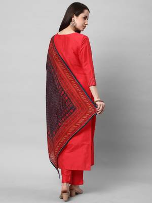 A straight kurta set with machine embroidery embellished with cut work. 2