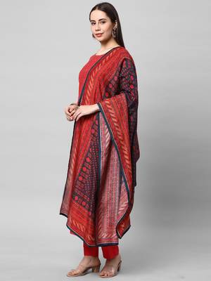 A straight kurta set with machine embroidery embellished with cut work. 3