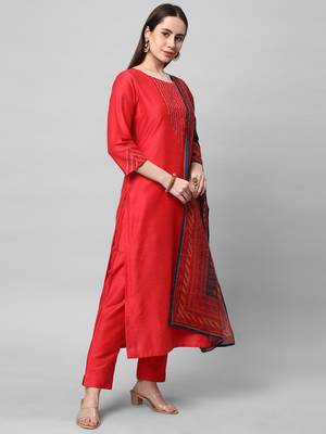 A straight kurta set with machine embroidery embellished with cut work. 4