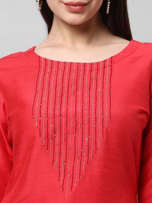 A straight kurta set with machine embroidery embellished with cut work. 5