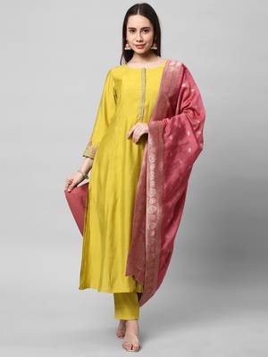 Embroidered a line kurta paired with brocade dupatta and straight pants. 1