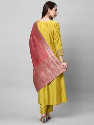 Embroidered a line kurta paired with brocade dupatta and straight pants. 2