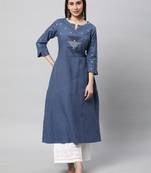 A line cotton kurta with a woven trim and hand embroidery.
