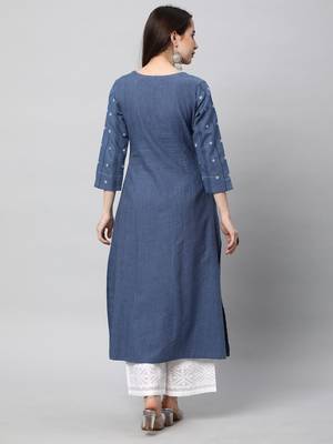 A line cotton kurta with a woven trim and hand embroidery. 2