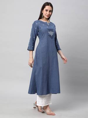 A line cotton kurta with a woven trim and hand embroidery. 3