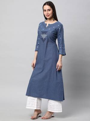 A line cotton kurta with a woven trim and hand embroidery. 4