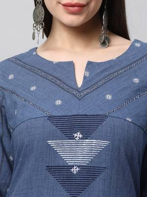 A line cotton kurta with a woven trim and hand embroidery. 5
