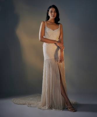 Beige embroidered trail gown with slit 1
