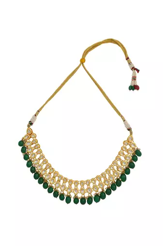 Gold toned kundan necklace with pair of earrings