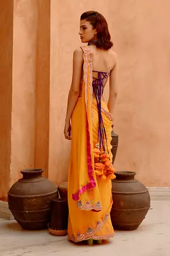 Mango yellow saree with bejewelled bandeau blouse
