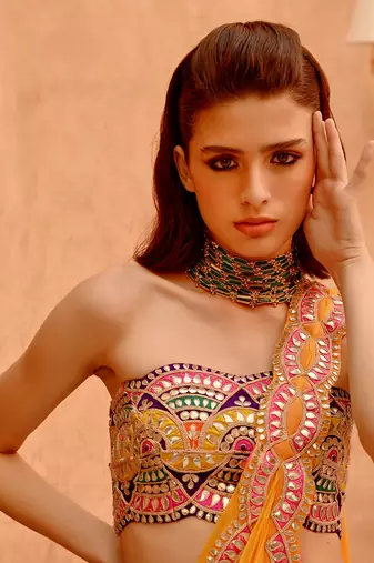Mango yellow saree with bejewelled bandeau blouse