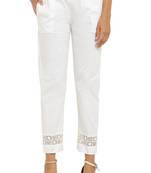 Pavonine white color stretchable sequence lace hem pencil trousers