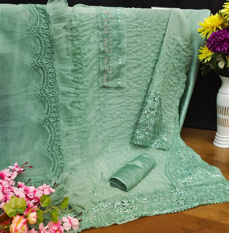 Light turquoise pakistani semi stitched suit with embroidery work