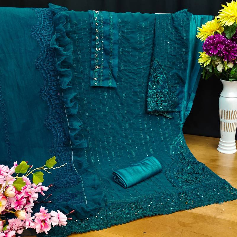 Teal green pakistani semi stitched suit with embroidery work