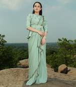 Mint green saree with peplum blouse
