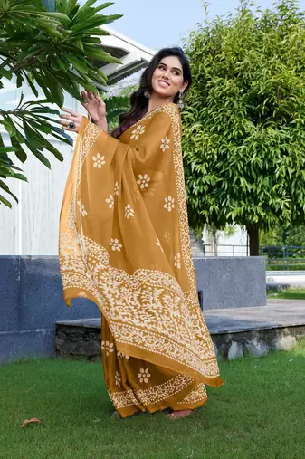 Mustard chiffon batik print saree with unstitched blouse piece