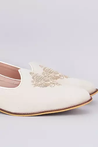 Off white embroidered suede slip on juttis