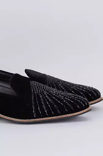 Black embroidered suede slip on loafers