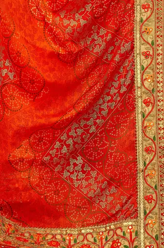 Orange chiffon bandhani saree with unstitched blouse piece