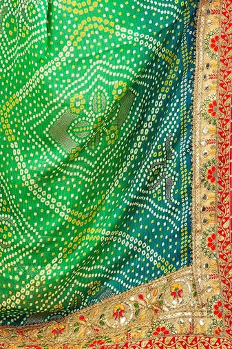 Green  chiffon bandhani saree with unstitched blouse piece