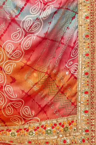 Peach  chiffon bandhani saree with unstitched blouse piece