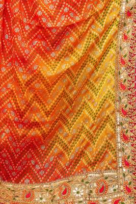 Yellow  chiffon bandhani saree with unstitched blouse piece 1