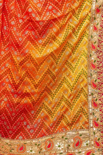 Yellow  chiffon bandhani saree with unstitched blouse piece