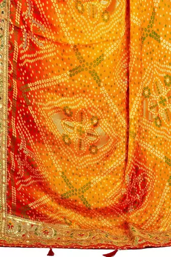 Yellow  chiffon bandhani saree with unstitched blouse piece