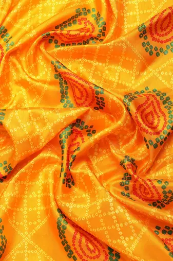 Yellow bandhani saree with lace border and unstitched blouse piece