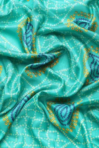 Blue bandhani saree with lace border and unstitched blouse piece