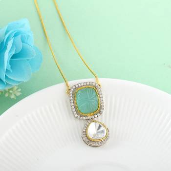 Classic kundan pendant with engraved aqua green stone 1