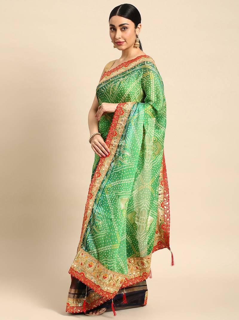 Green bandhani saree with lace border and unstitched blouse piece