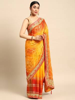 Yellow bandhani saree with lace border and unstitched blouse piece 1