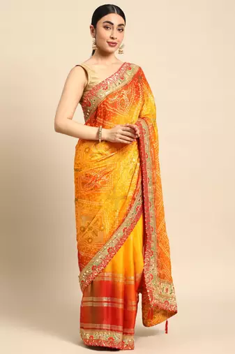Yellow bandhani saree with lace border and unstitched blouse piece