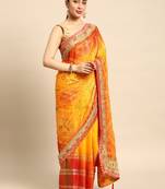 Yellow bandhani saree with lace border and unstitched blouse piece