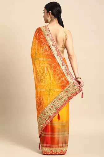 Yellow bandhani saree with lace border and unstitched blouse piece
