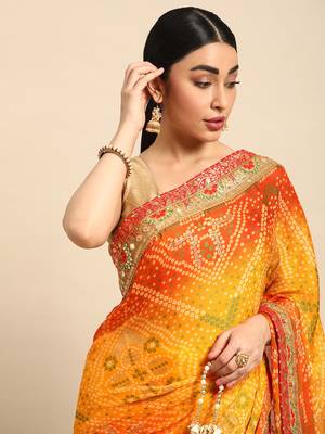 Yellow bandhani saree with lace border and unstitched blouse piece 3