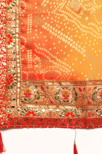Yellow bandhani saree with lace border and unstitched blouse piece