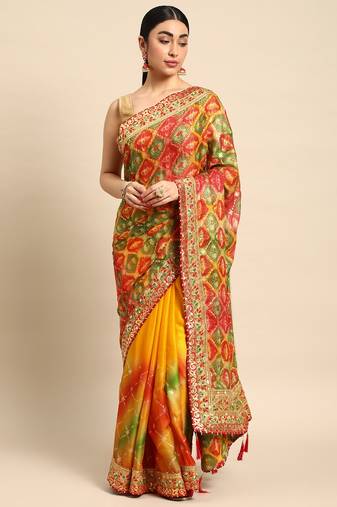 Yellow bandhani saree with lace border and unstitched blouse piece