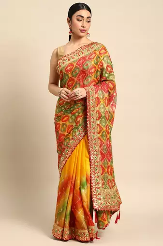Yellow bandhani saree with lace border and unstitched blouse piece