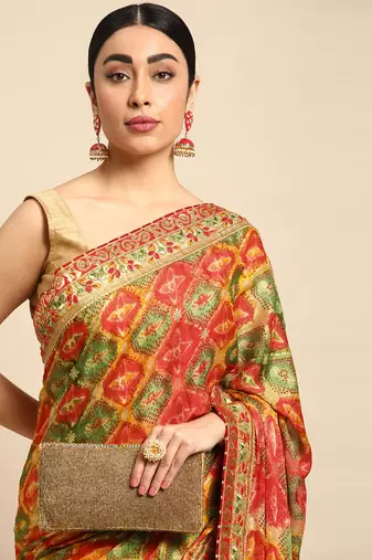 Yellow bandhani saree with lace border and unstitched blouse piece