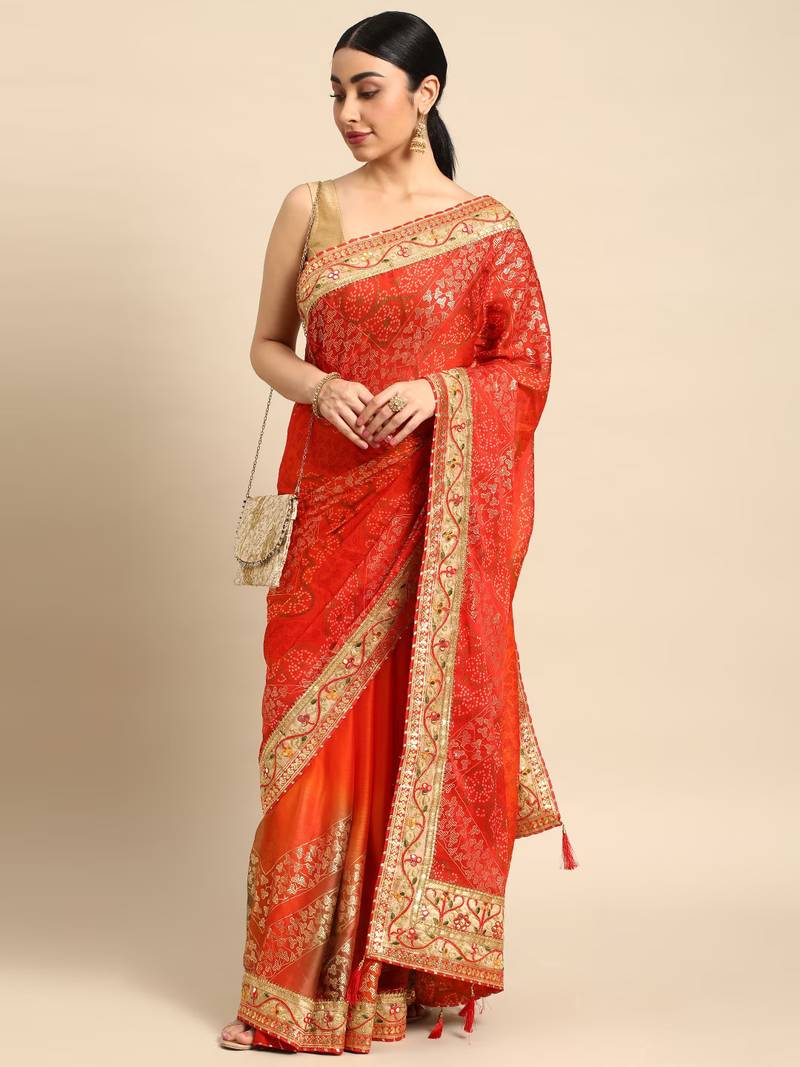 Red bandhani saree with lace border and unstitched blouse piece