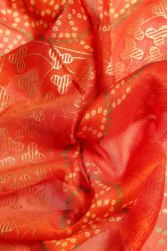 Red bandhani saree with lace border and unstitched blouse piece