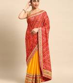 Yellow bandhani saree with lace border and unstitched blouse piece