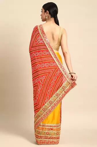 Yellow bandhani saree with lace border and unstitched blouse piece