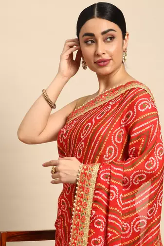 Yellow bandhani saree with lace border and unstitched blouse piece