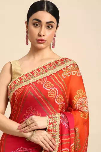 Peach bandhani saree with lace border and unstitched blouse piece