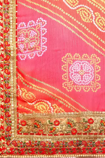 Peach bandhani saree with lace border and unstitched blouse piece
