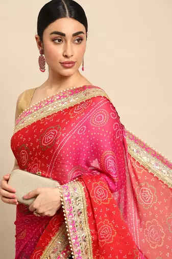 Blue bandhani saree with lace border and unstitched blouse piece